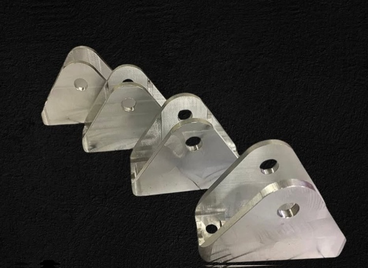 Small precision machined brackets
